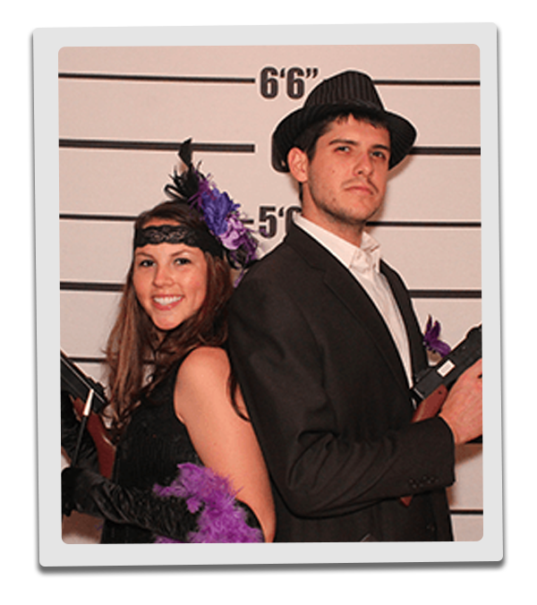 Philadelphia Murder Mystery party guests pose for mugshots