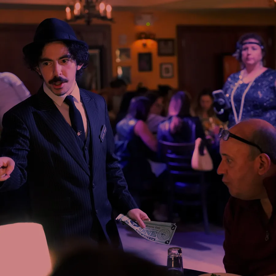 A Murder Mystery Company actor working the room at a Philadelphia show