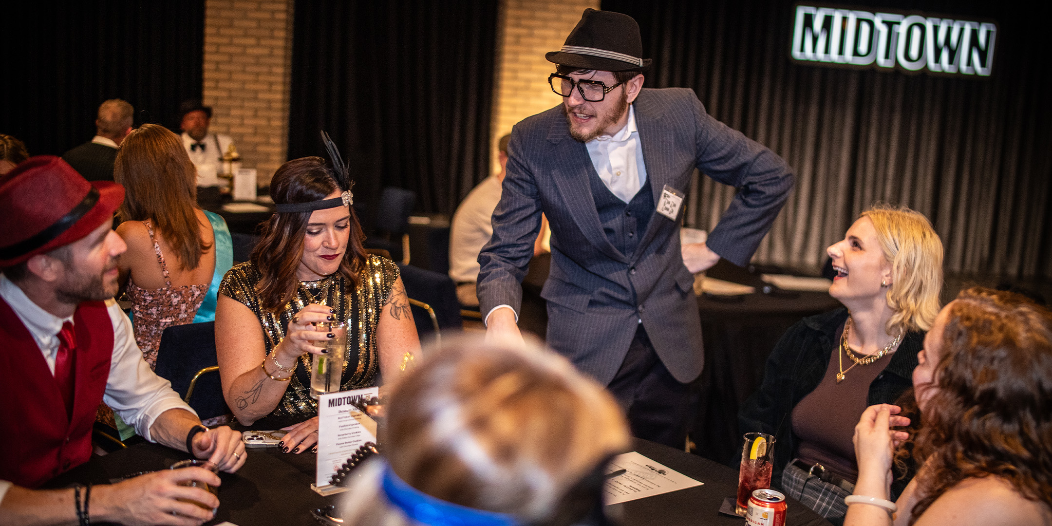Guests at a Murder Mystery Company public dinner show in Philadelphia